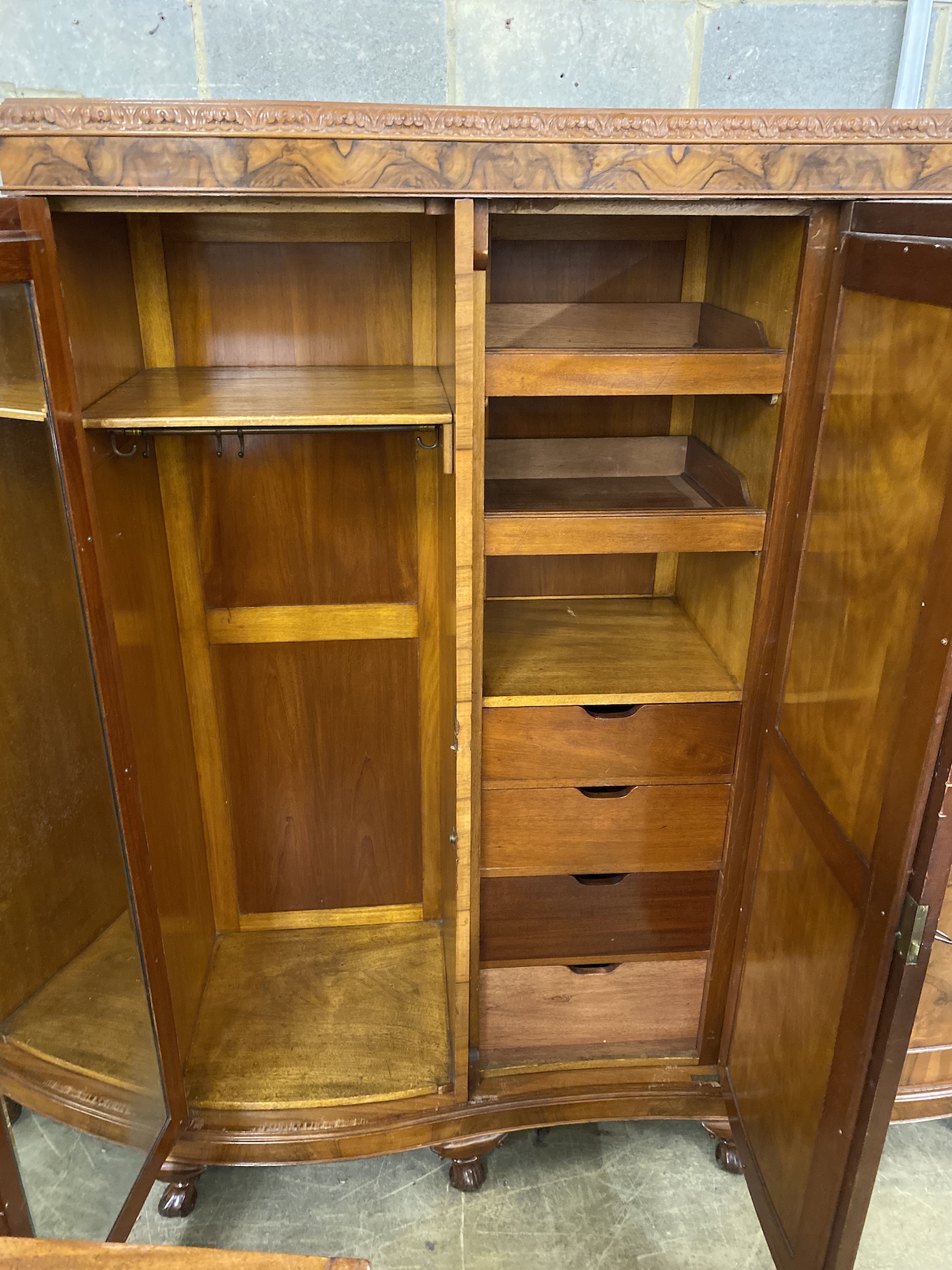 A Queen Anne revival figured walnut triple wardrobe, width 180cm, depth 56cm, height 205cm